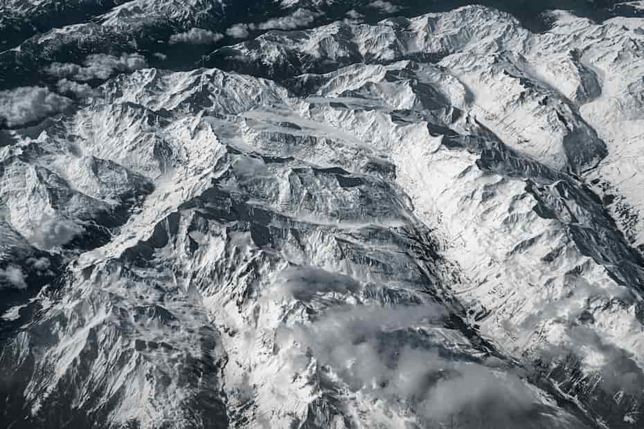 Aerial photography over the Alps: Alpern Clouds, Flying from Trieste (Italy) to Stansted (England), 2024