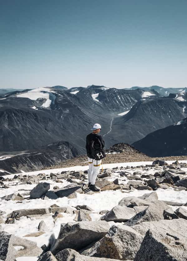 Harald Revery with his branded backpack looking over Jotunheimen