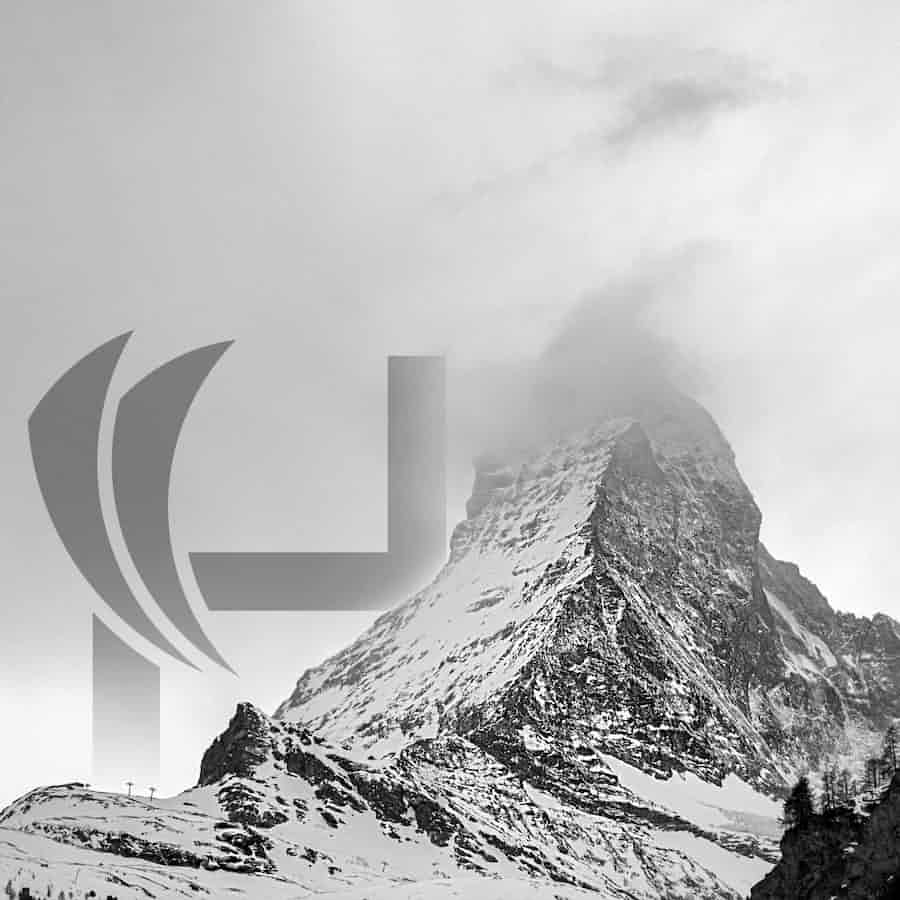 Harald Revery logo behind mountain Matterhorn